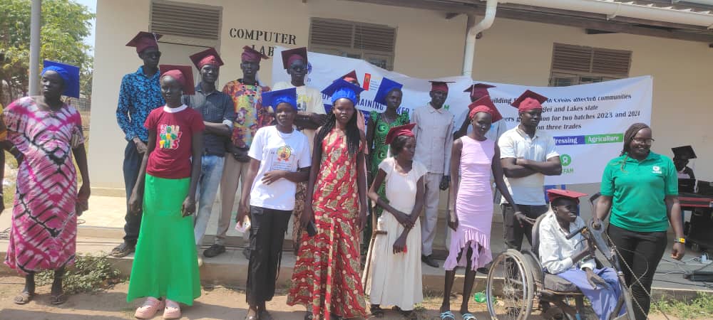 Vocational training graduates in Rumbek, including a graduate using a wheelchair, at a Building Resilience ceremony